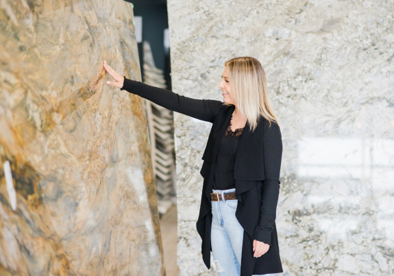 Woman touching granite